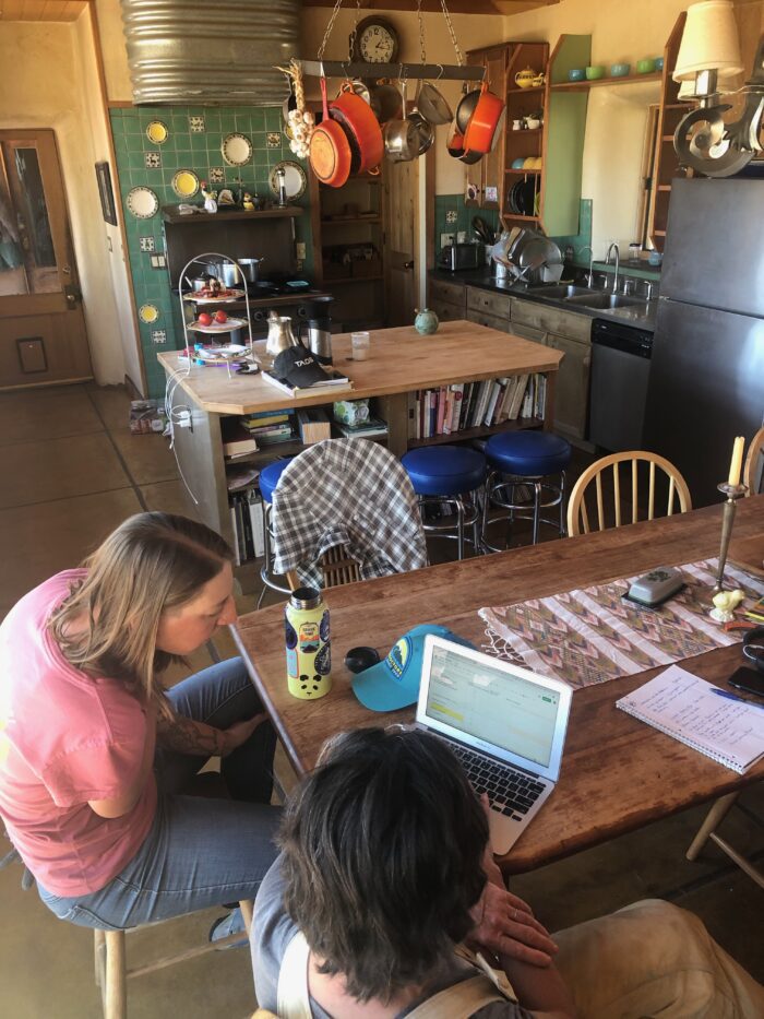 Two women working on a laptop