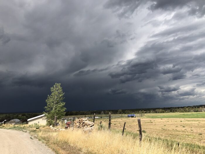 A view of fields under a dark sky