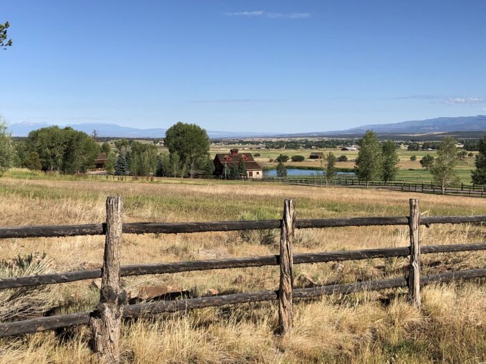 A fenced grass fields